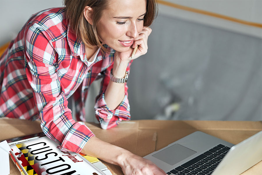 Divirsified Tag and Title Tag Title and Specialty Tags page image of a woman standing at a computer.